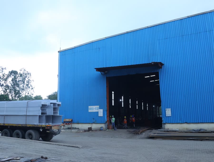 Fabrication shed, trailer loading