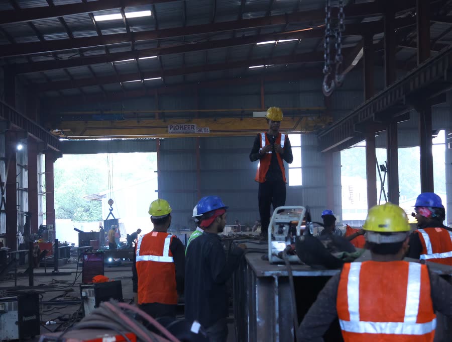 Fabrication crew in the main shed