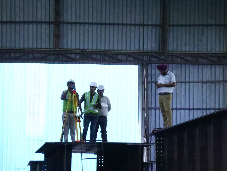 Survey team on a girder